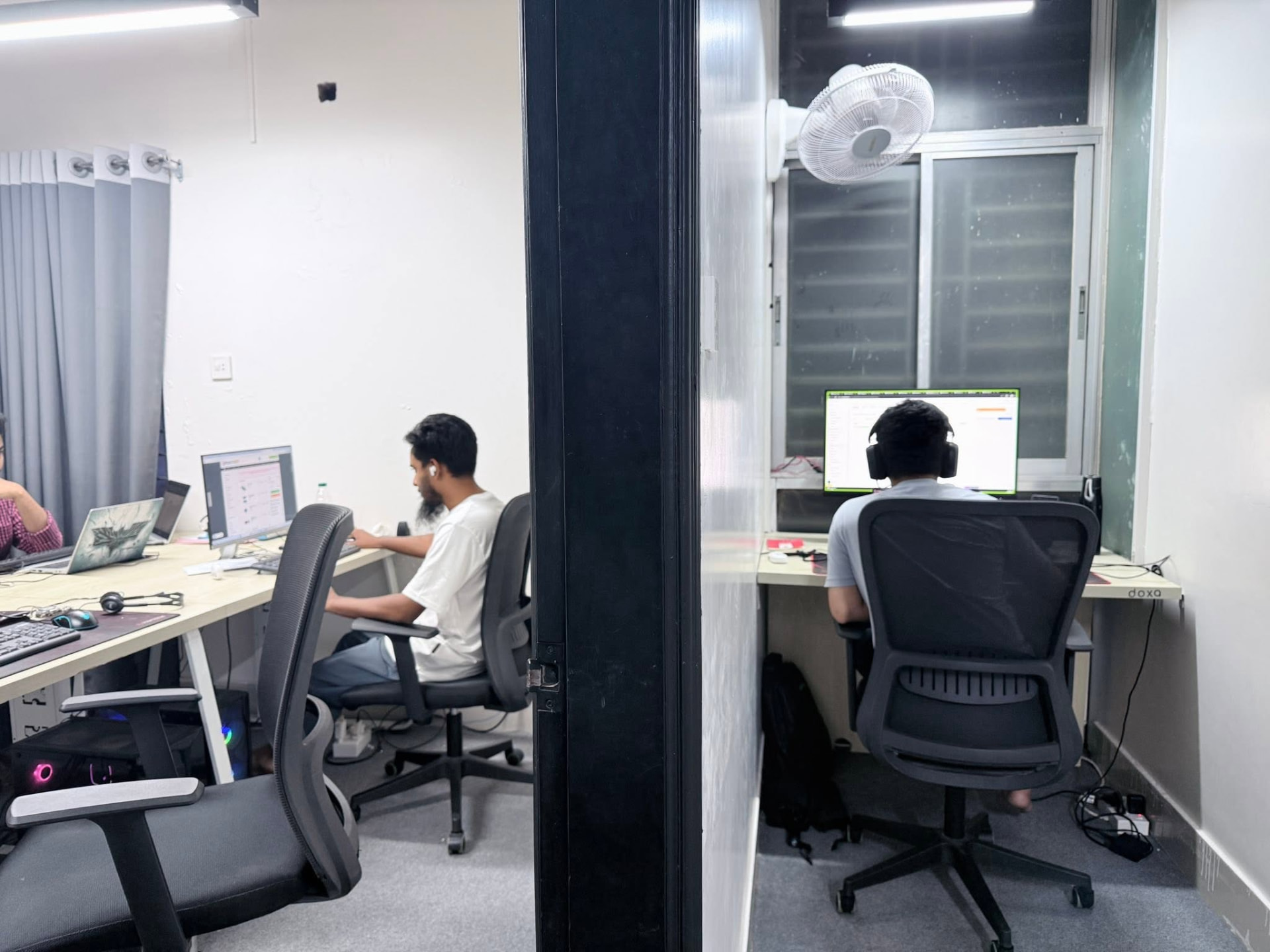 Gooseberry team member focused on a laptop
